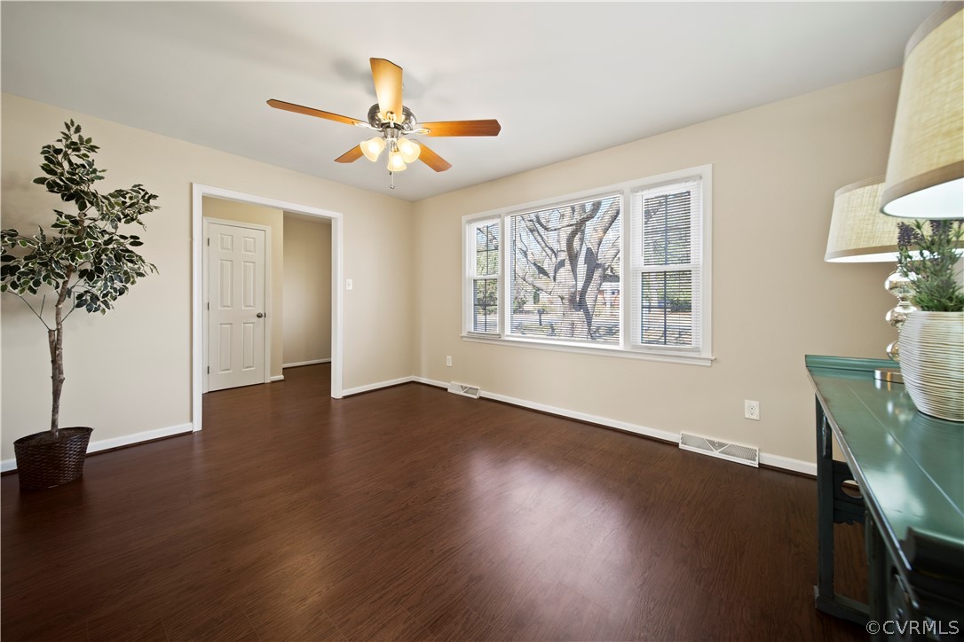 505 Bermuda Hundred Road Chester, VA 23836 - Photo 8 of 45 a view of an empty room with wooden floor and a window