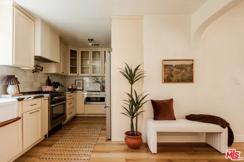 a kitchen with a stove and cabinets