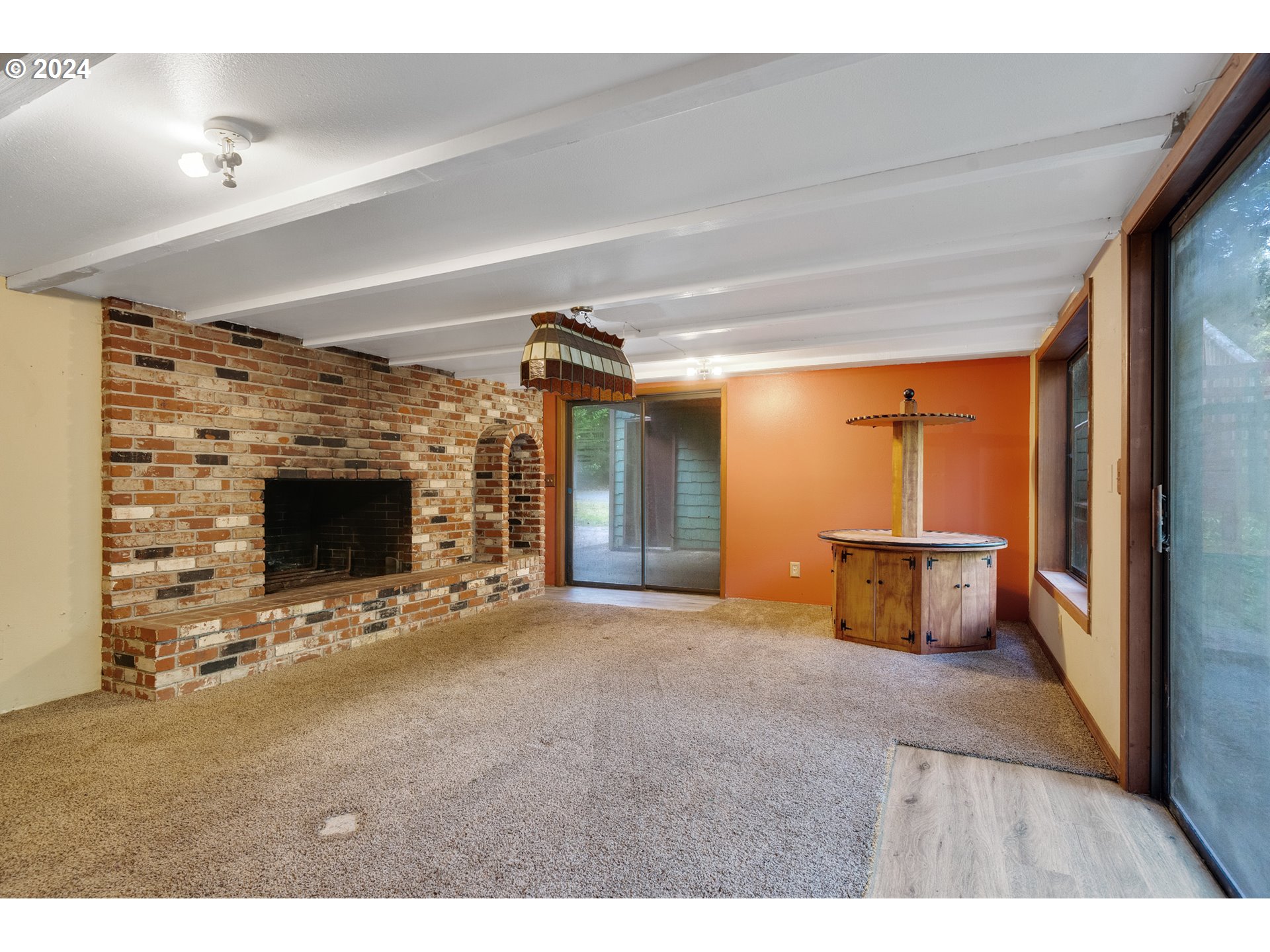15555 Trask River Road Tillamook, OR 97141 - Photo 19 of 30 a view of an empty room with a fireplace and a window