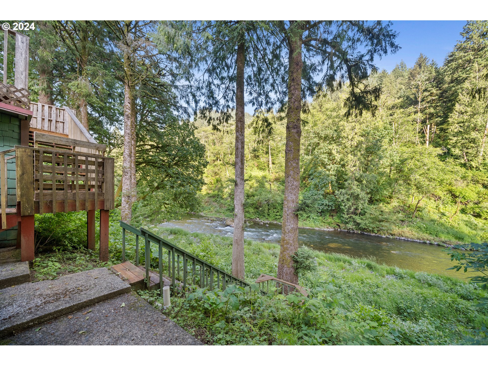 15555 Trask River Road Tillamook, OR 97141 - Photo 3 of 30 a view of a garden from a patio