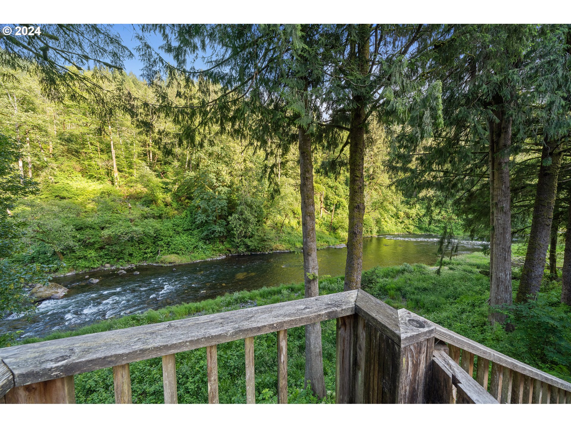 15555 Trask River Road Tillamook, OR 97141 - Photo 5 of 30 a balcony with trees in front of it