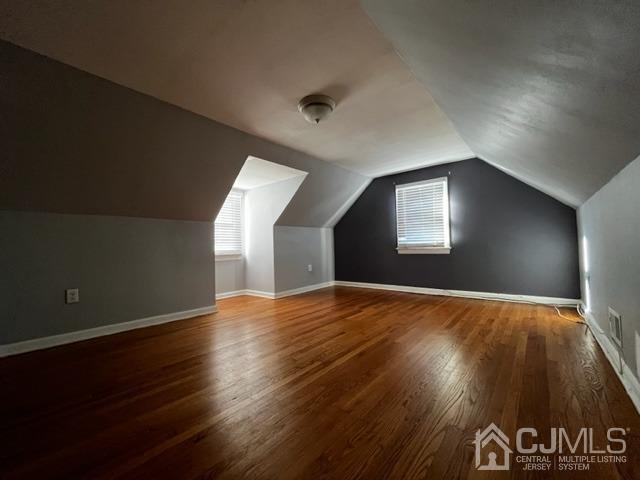 89 Leo Street Edison, NJ 08817 - Photo 14 of 31 a view of an empty room with wooden floor and a window