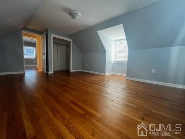 89 Leo Street Edison, NJ 08817 - Photo 15 of 31 an empty room with wooden floor and windows