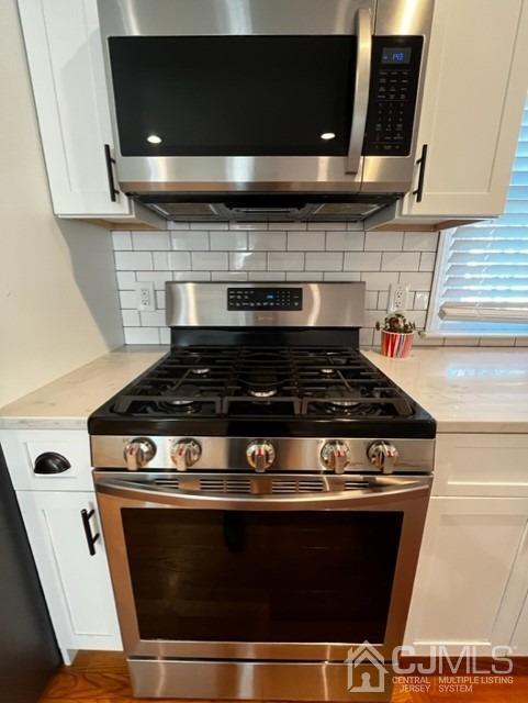 89 Leo Street Edison, NJ 08817 - Photo 19 of 31 a stove top oven sitting inside of a kitchen