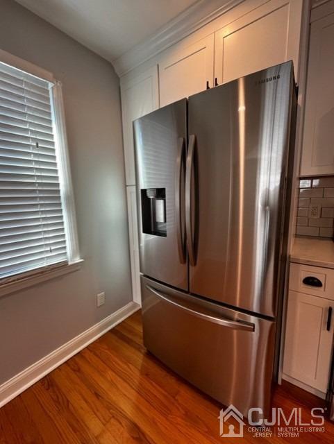 89 Leo Street Edison, NJ 08817 - Photo 20 of 31 a kitchen with stainless steel appliances a refrigerator and wooden floor