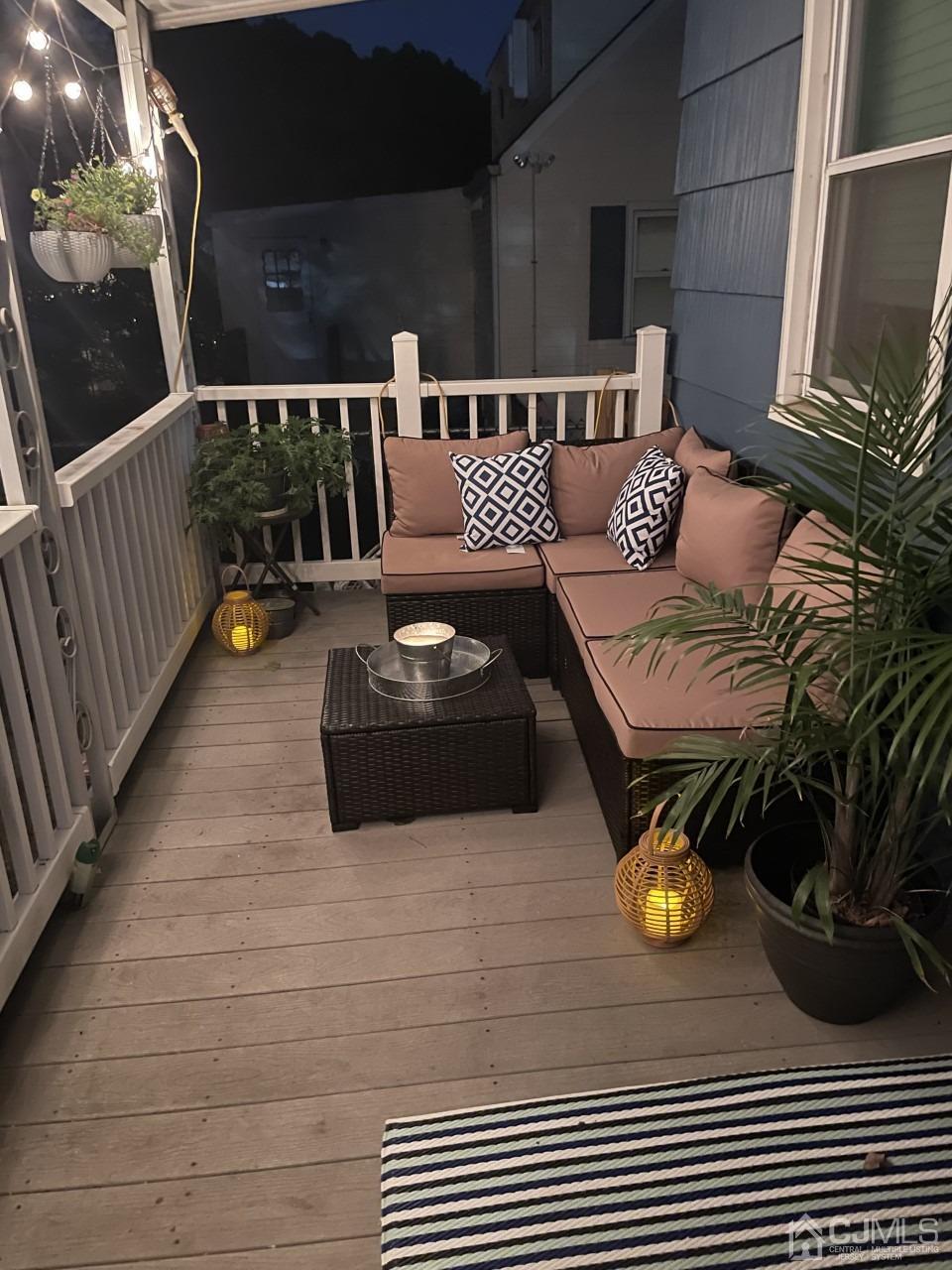 89 Leo Street Edison, NJ 08817 - Photo 25 of 31 a roof deck with couches and wooden floor