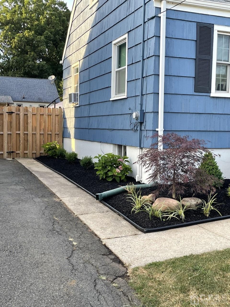 89 Leo Street Edison, NJ 08817 - Photo 30 of 31 a view of a backyard with potted plants