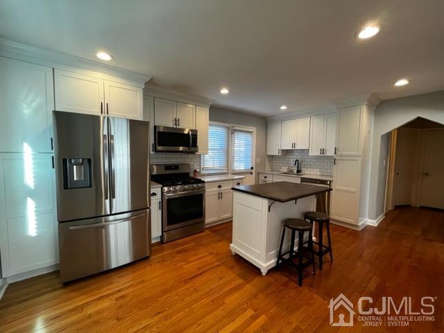 89 Leo Street Edison, NJ 08817 - Photo 4 of 31 a kitchen with granite countertop a refrigerator and a stove top oven