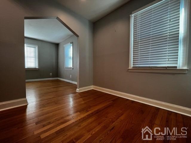 89 Leo Street Edison, NJ 08817 - Photo 6 of 31 a view of an empty room with wooden floor and a window