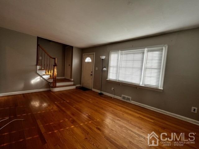 89 Leo Street Edison, NJ 08817 - Photo 8 of 31 a view of an empty room with window and wooden floor