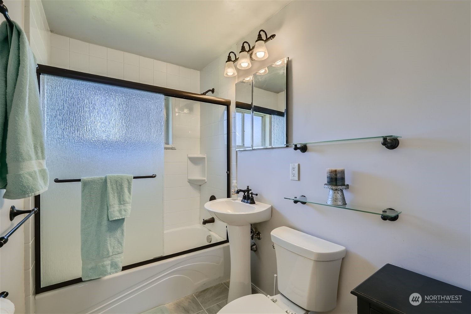 675 Edmonds Avenue Northeast Renton, WA 98056 - Photo 6 of 14 a bathroom with a sink toilet and mirror