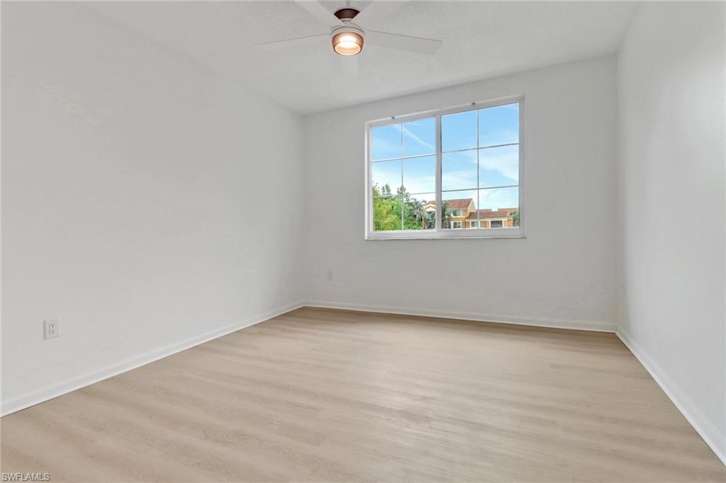 1190 Reserve Way, Unit 206 Naples, FL 34105 - Photo 11 of 35 an empty room with windows