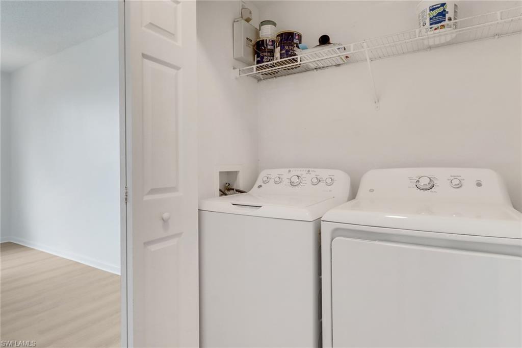 1190 Reserve Way, Unit 206 Naples, FL 34105 - Photo 21 of 35 a utility room with dryer and washer