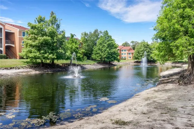 a view of a lake with a house in the background