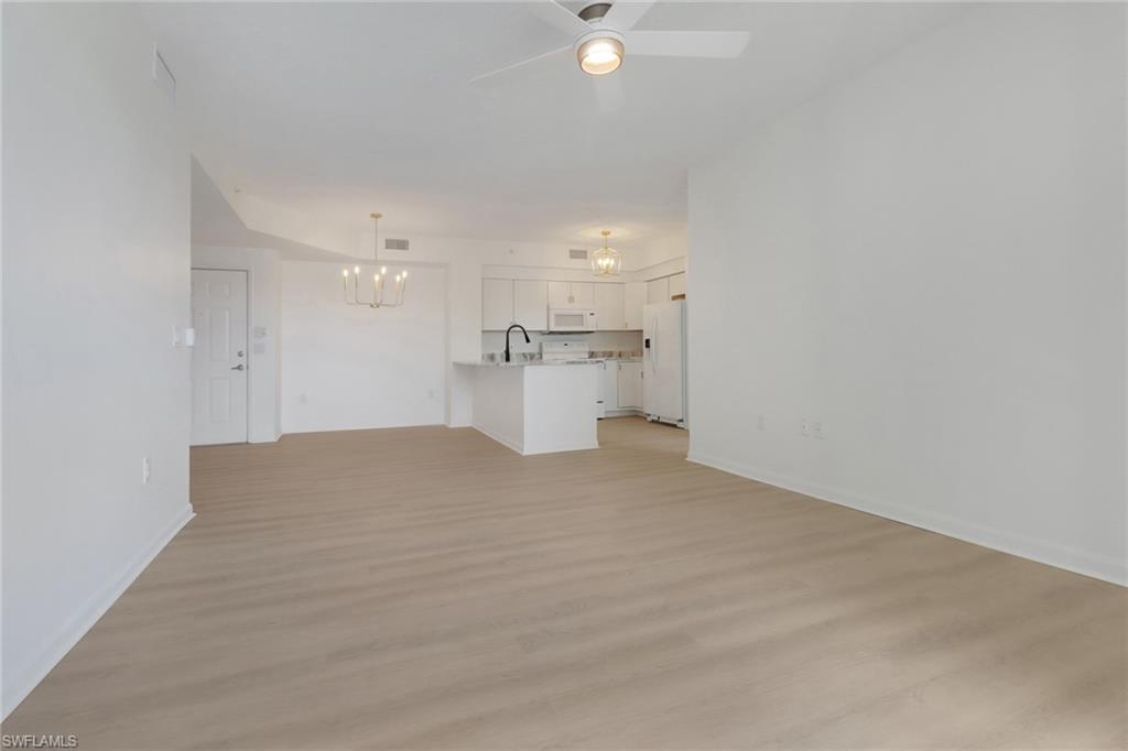 1190 Reserve Way, Unit 206 Naples, FL 34105 - Photo 8 of 35 a view of empty room with a kitchen