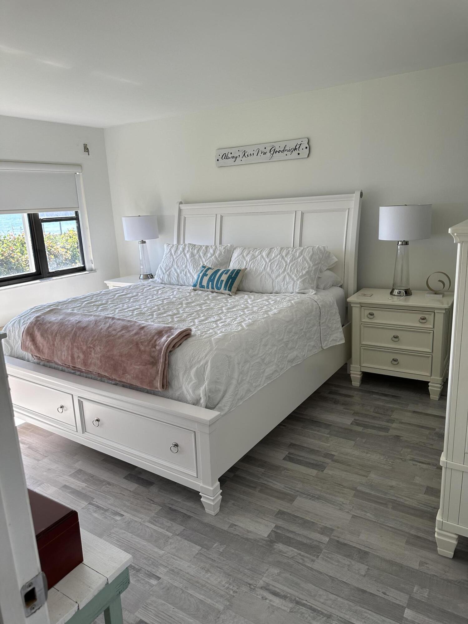 7370 South Ocean Drive, Unit 215 Jensen Beach, FL 34957 - Photo 15 of 51 a bedroom with a bed and a dresser