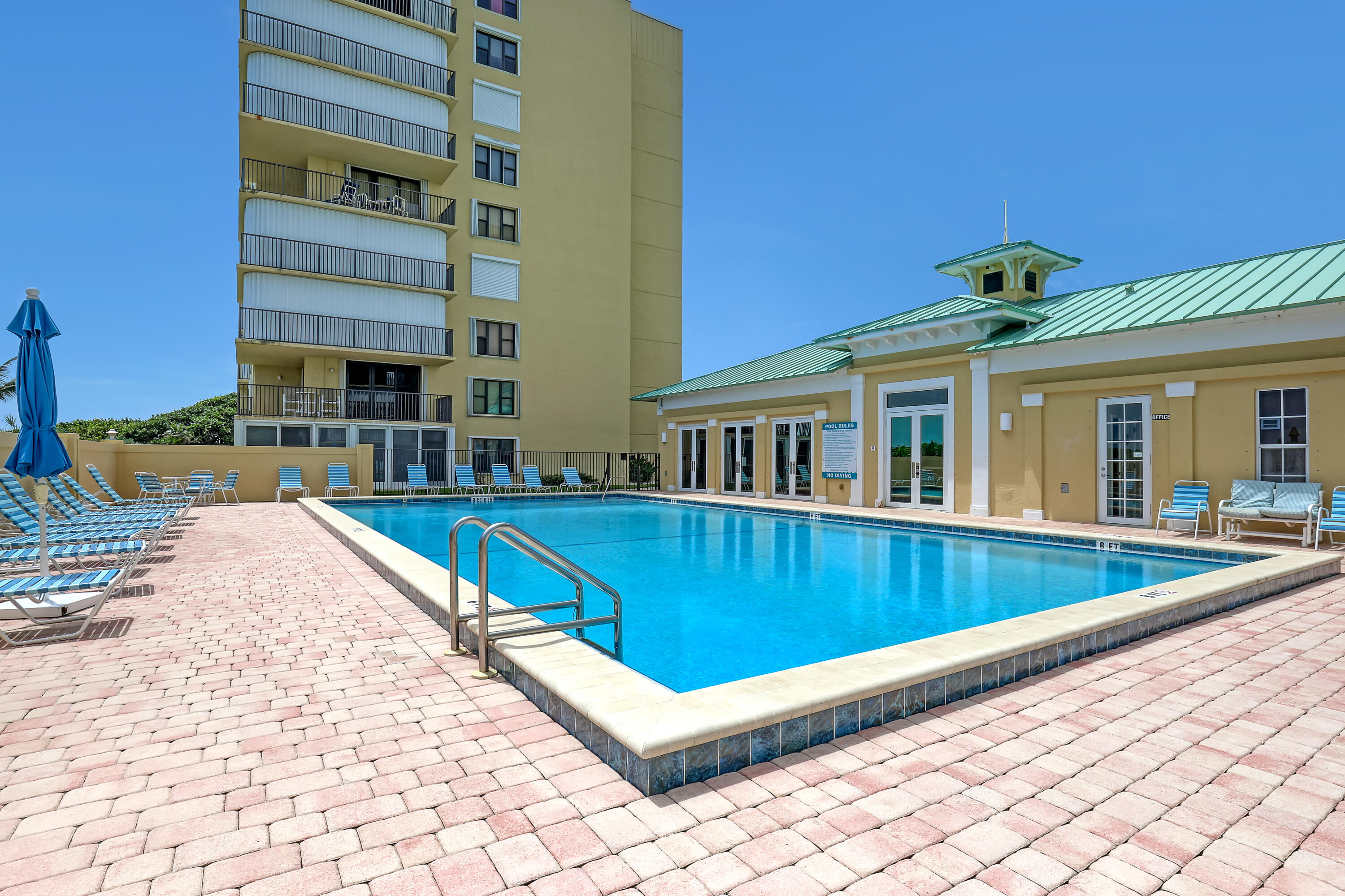 7370 South Ocean Drive, Unit 215 Jensen Beach, FL 34957 - Photo 39 of 51 a view of a house with a swimming pool