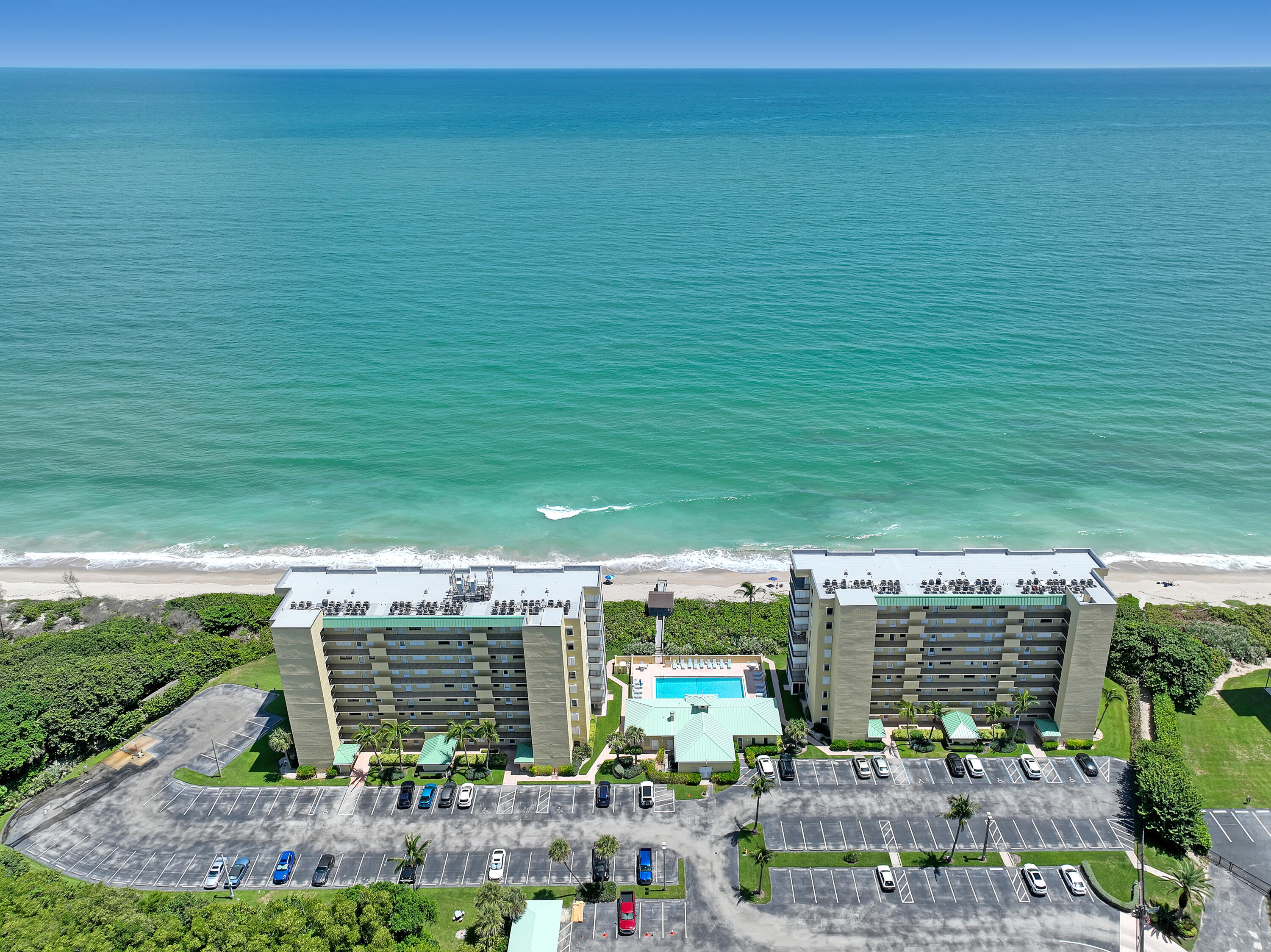 7370 South Ocean Drive, Unit 215 Jensen Beach, FL 34957 - Photo 4 of 51 a view of a swimming pool with outdoor space