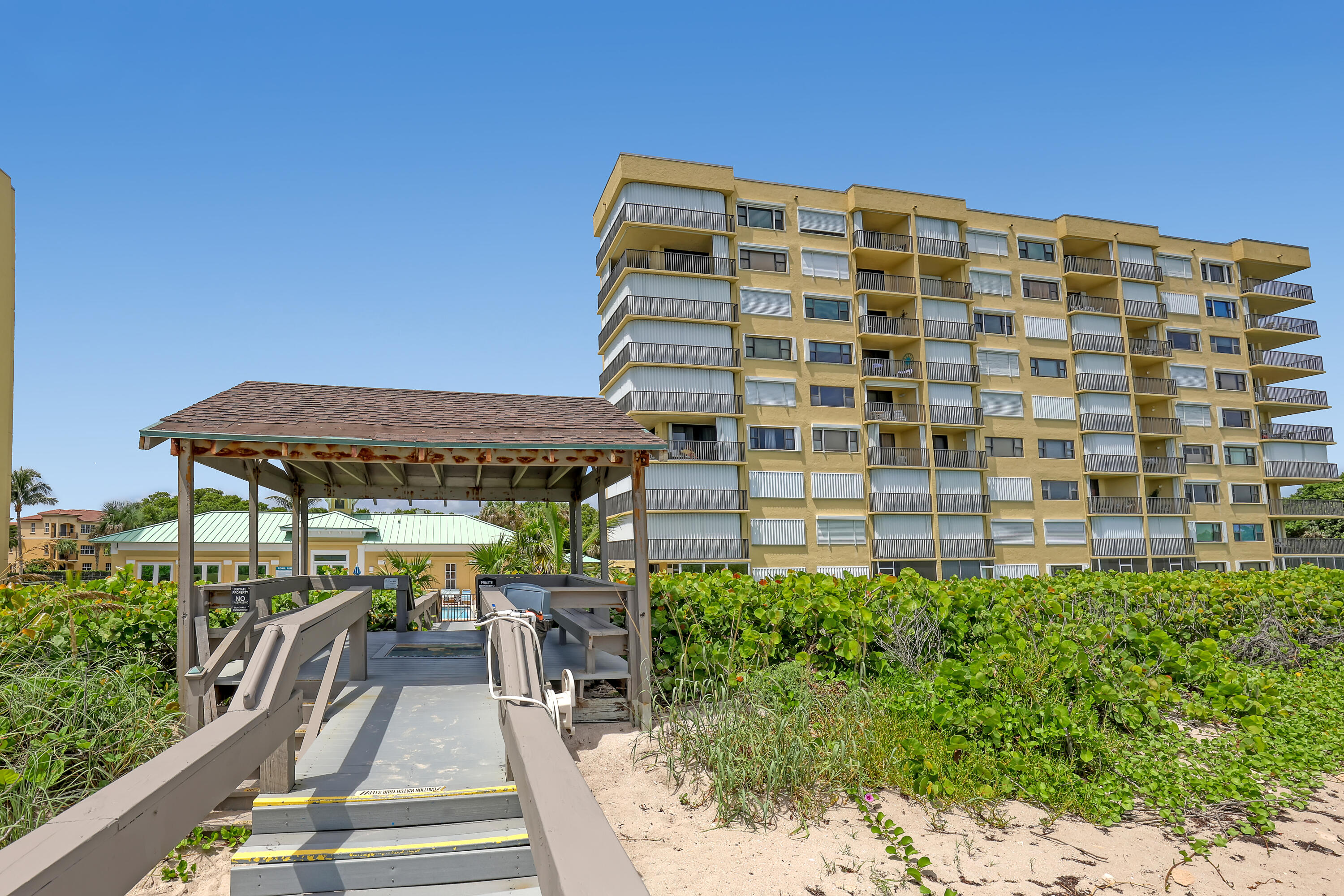 7370 South Ocean Drive, Unit 215 Jensen Beach, FL 34957 - Photo 41 of 51 a view of a building with porch and sitting area