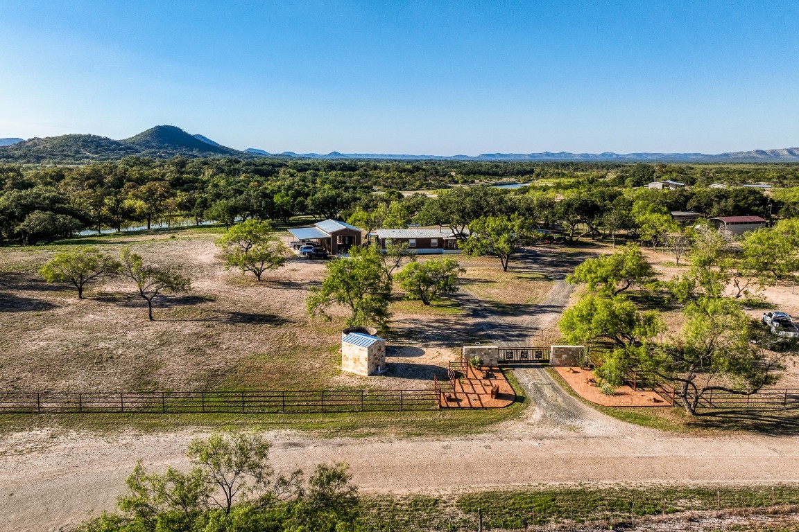 4991 County Road 416 Uvalde, TX 78801 - Photo 4 of 40 a view of a lake with houses