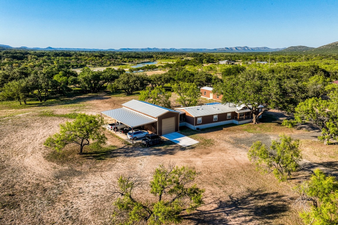4991 County Road 416 Uvalde, TX 78801 - Photo 6 of 40 a view of a swimming pool with an ocean view