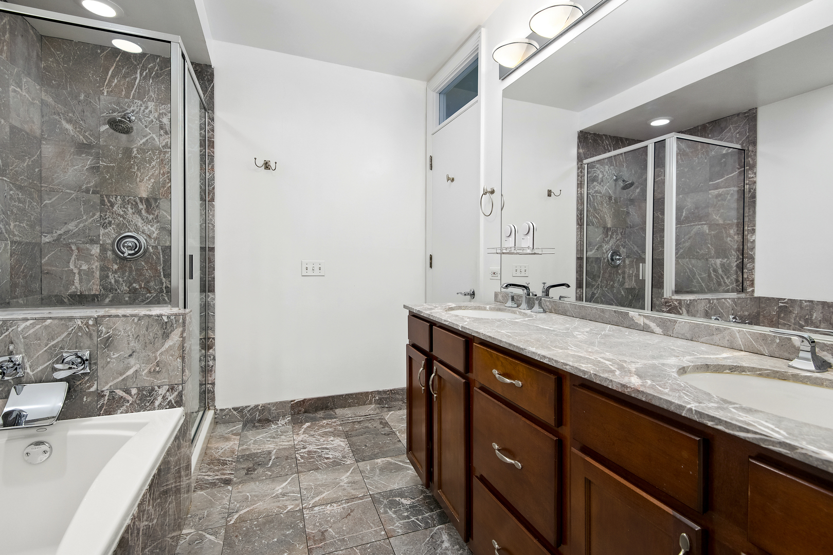 520 North Peoria Street Chicago, IL 60642 - Photo 10 of 20 a bathroom with a granite countertop sink mirror and shower