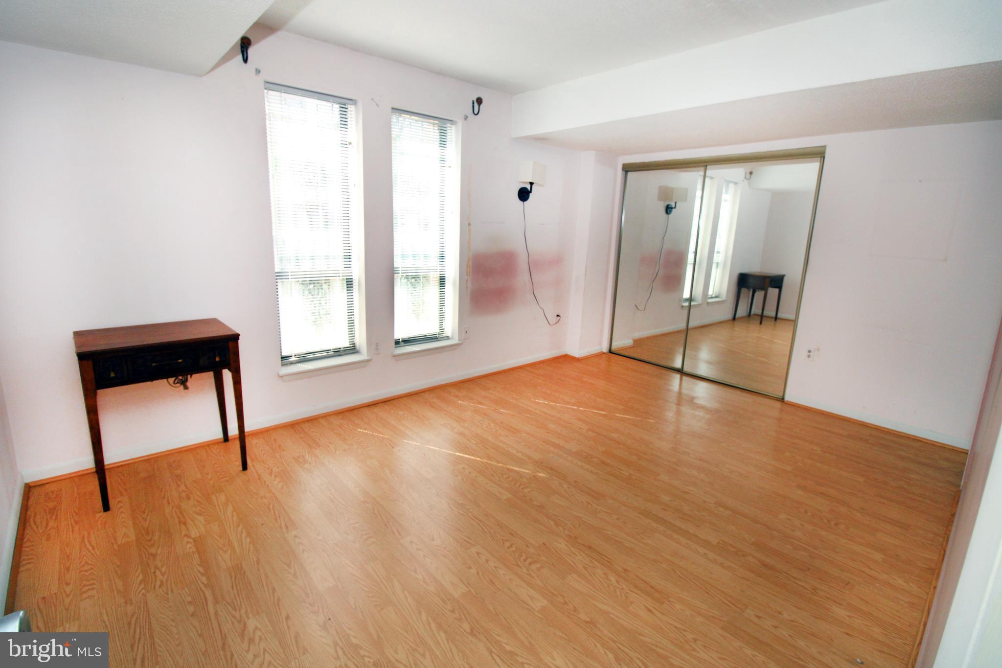 592 Brummel Court Northwest, Unit 592 Washington, DC 20012 - Photo 9 of 13 a view of empty room with wooden floor and fan