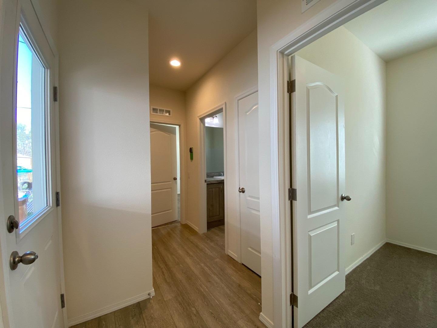 5812 Cedars Road, Unit 13 Redding, CA 96001 - Photo 5 of 12 a view of a hallway with wooden floor