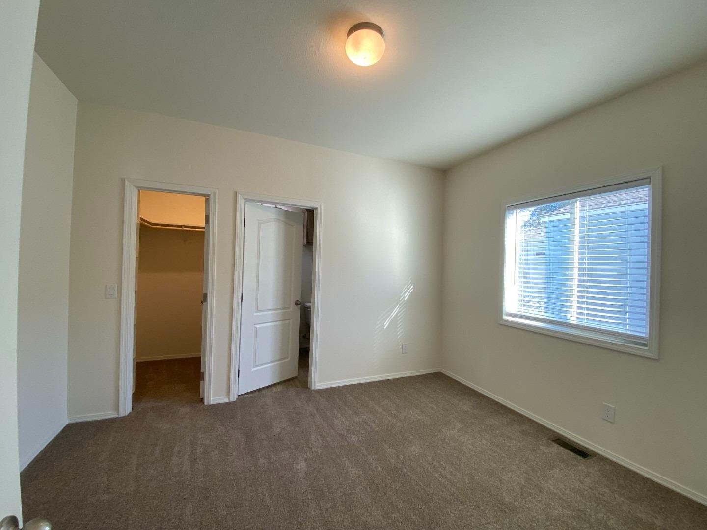 5812 Cedars Road, Unit 13 Redding, CA 96001 - Photo 9 of 12 an empty room with a window