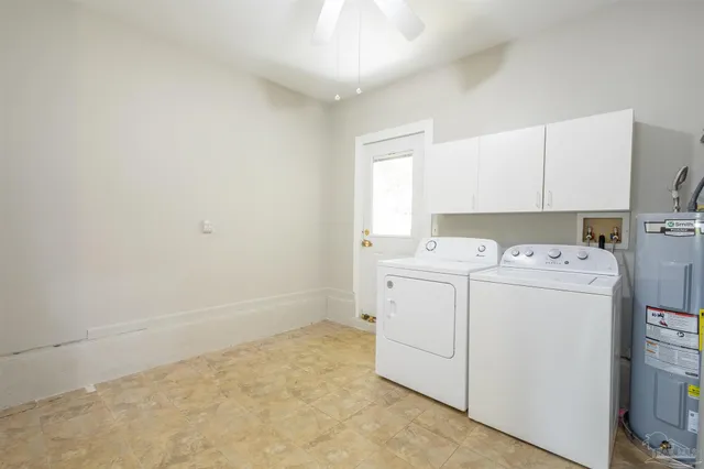 a view of storage and utility room with washer and dryer
