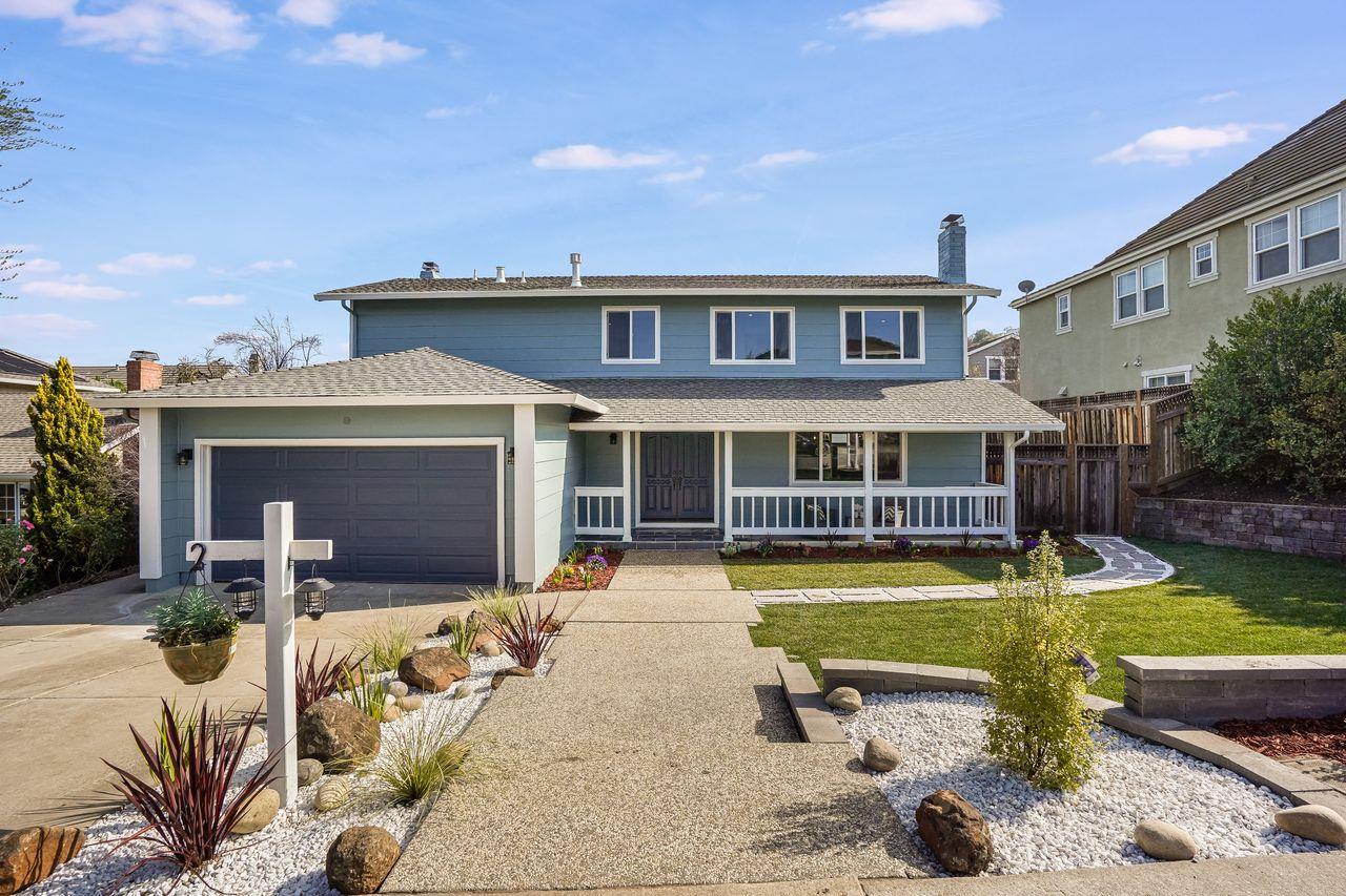 a view of a house with swimming pool and sitting area