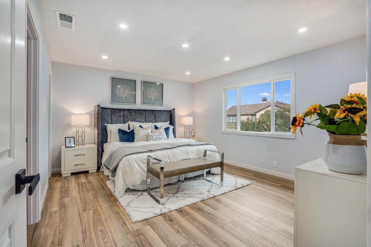 6586 Broadacres Drive San Jose, CA 95120 - Photo 14 of 37 a bedroom with a bed and a potted plant