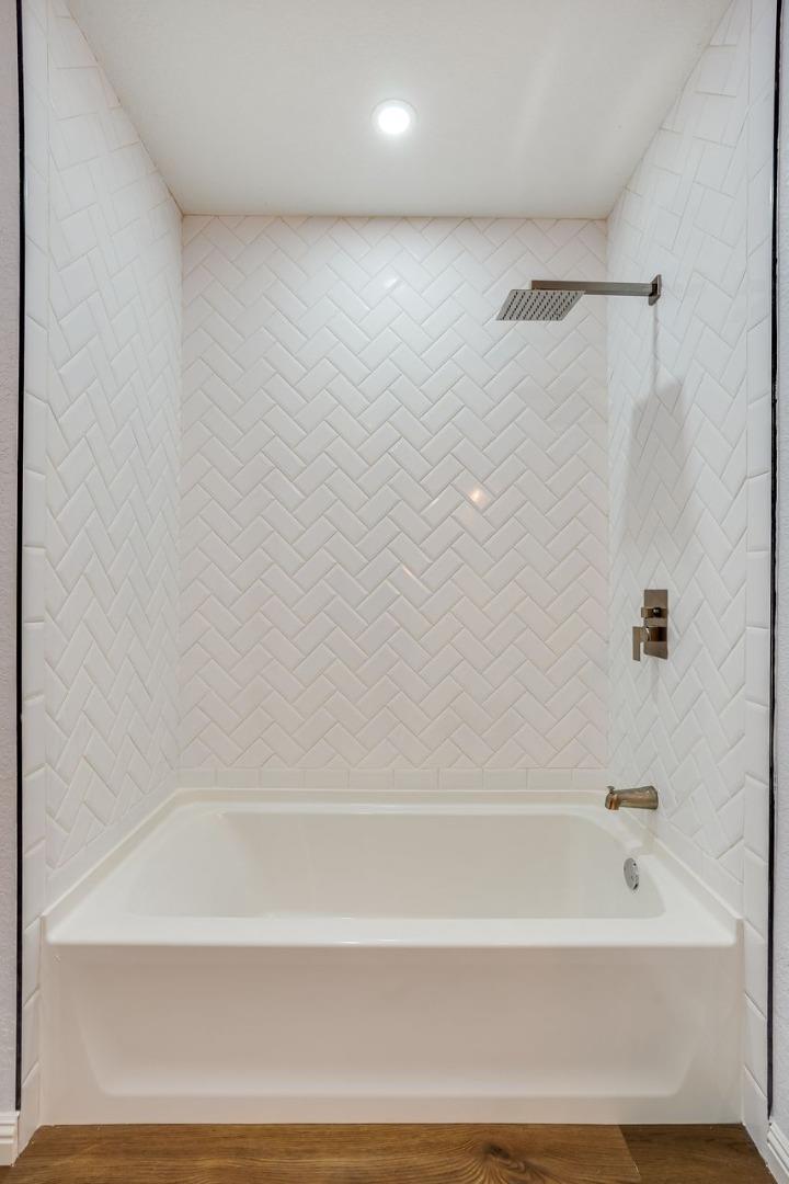 6586 Broadacres Drive San Jose, CA 95120 - Photo 19 of 37 a bathroom with a bathtub
