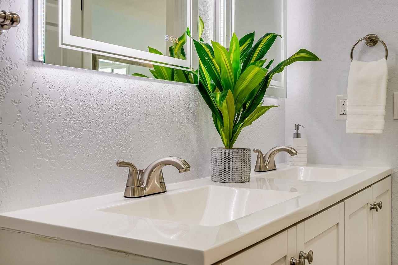 6586 Broadacres Drive San Jose, CA 95120 - Photo 20 of 37 a close view of sink and a potted plant on a counter