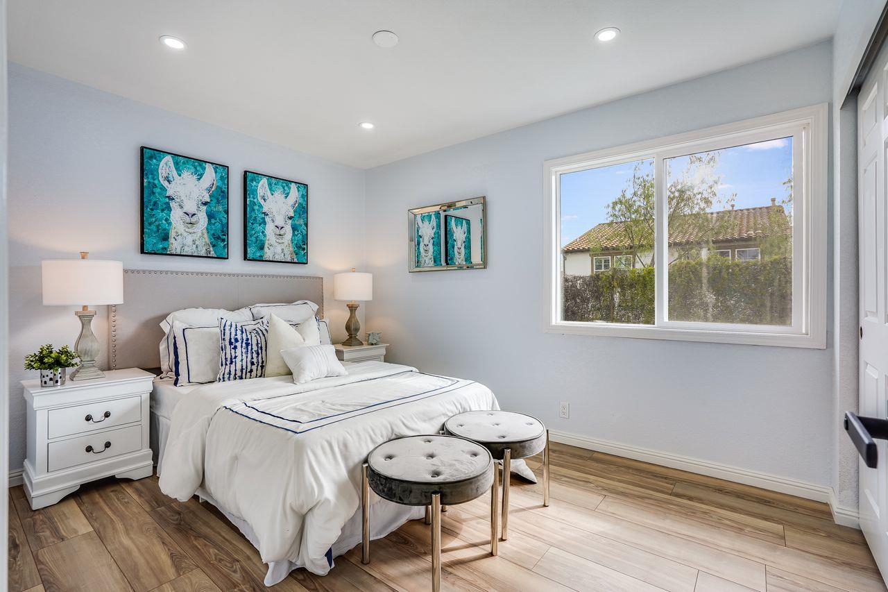 6586 Broadacres Drive San Jose, CA 95120 - Photo 21 of 37 a bedroom with a bed a large window with outer view and chair