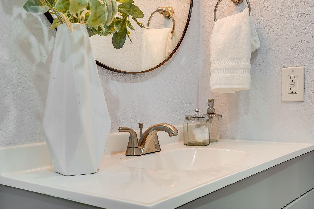 6586 Broadacres Drive San Jose, CA 95120 - Photo 25 of 37 a bathroom with a sink and a mirror