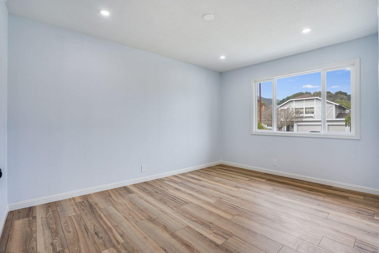 6586 Broadacres Drive San Jose, CA 95120 - Photo 28 of 37 a view of empty room with wooden floor and fan