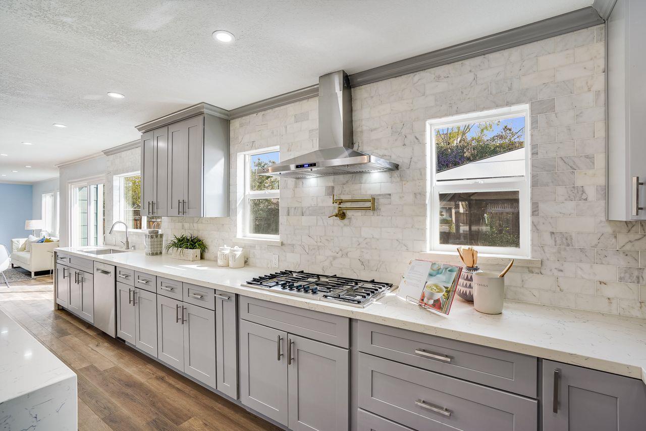 6586 Broadacres Drive San Jose, CA 95120 - Photo 5 of 37 a kitchen with stainless steel appliances a sink stove and cabinets