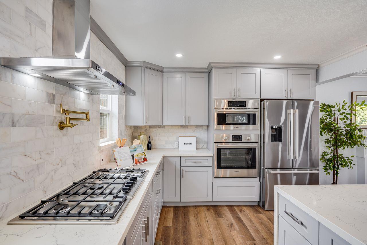 6586 Broadacres Drive San Jose, CA 95120 - Photo 8 of 37 a kitchen with refrigerator a stove and cabinets