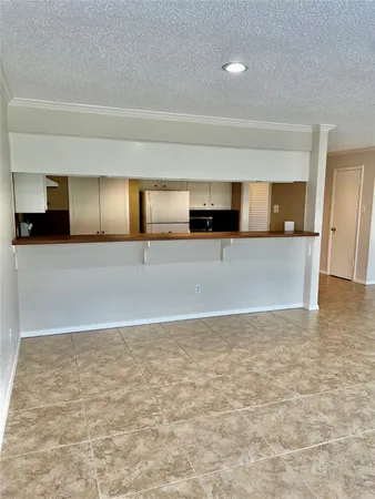 a view of a kitchen with a dishwasher and cabinets