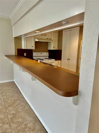 a view of kitchen and wooden floor