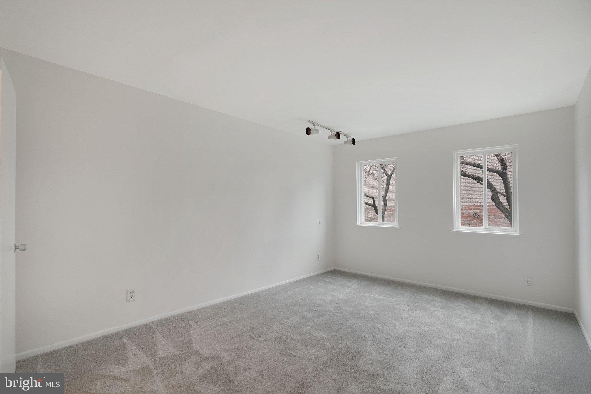 5020 7th Road South, Unit 102 Arlington, VA 22204 - Photo 13 of 30 an empty room with windows