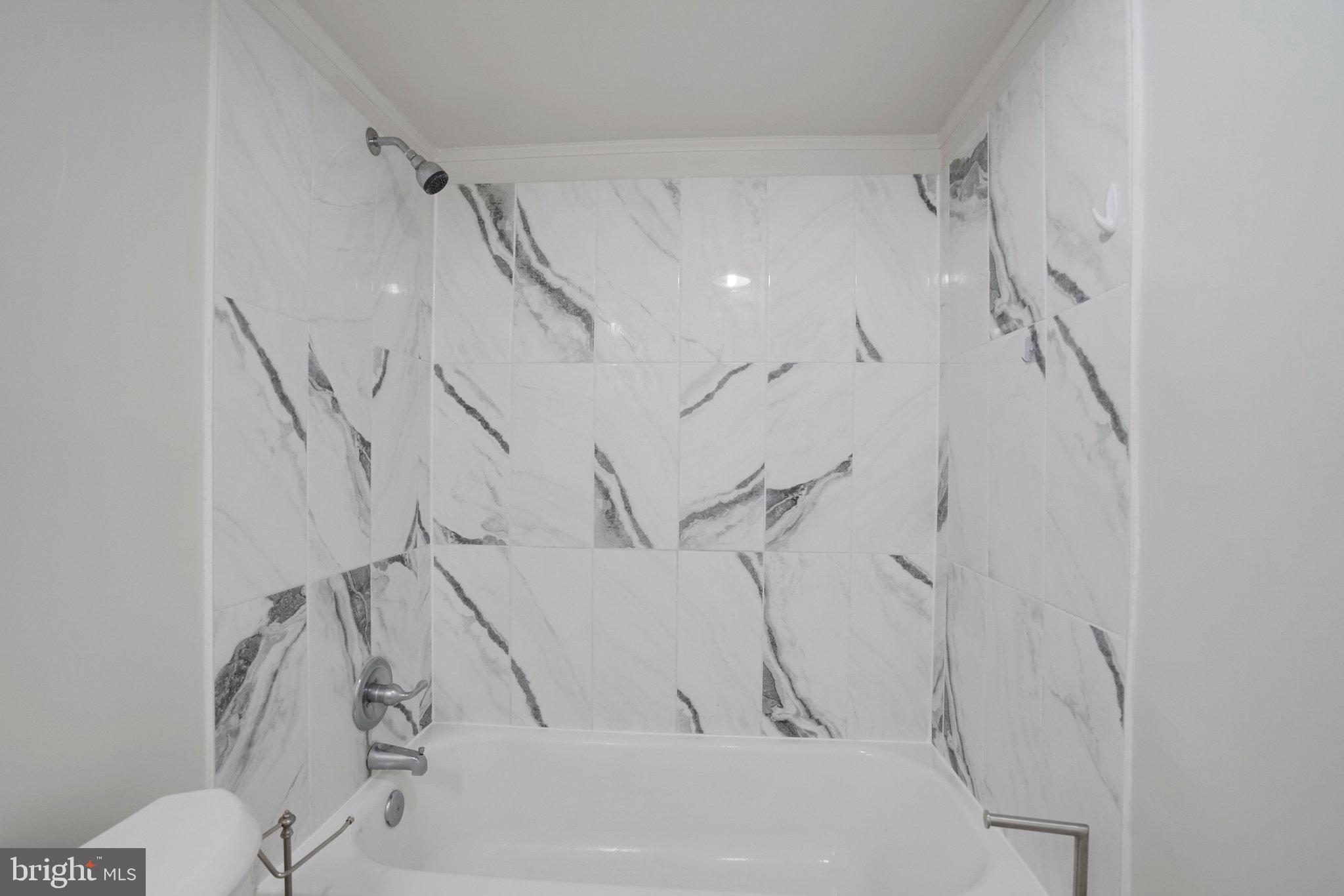 5020 7th Road South, Unit 102 Arlington, VA 22204 - Photo 21 of 30 a view of a bathtub in a bathroom