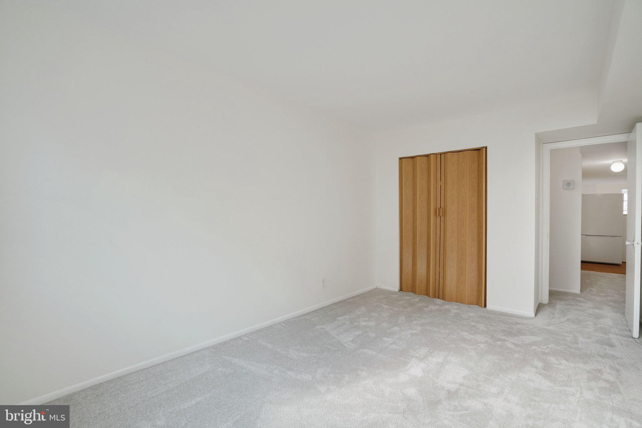 5020 7th Road South, Unit 102 Arlington, VA 22204 - Photo 23 of 30 a view of an empty room and closet area