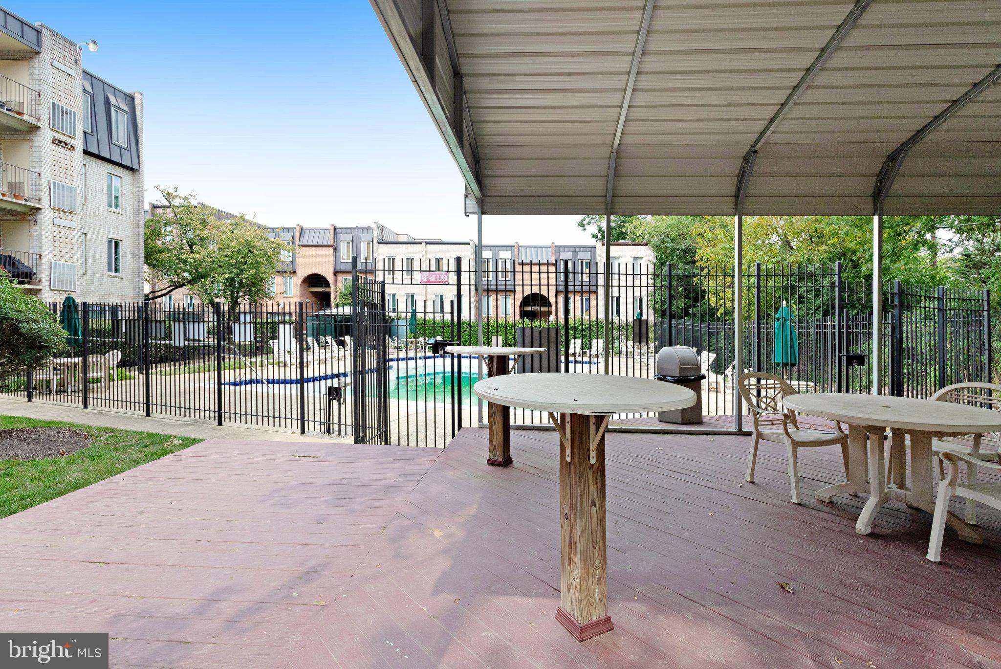 5020 7th Road South, Unit 102 Arlington, VA 22204 - Photo 28 of 30 a building outdoor space with patio furniture and garden