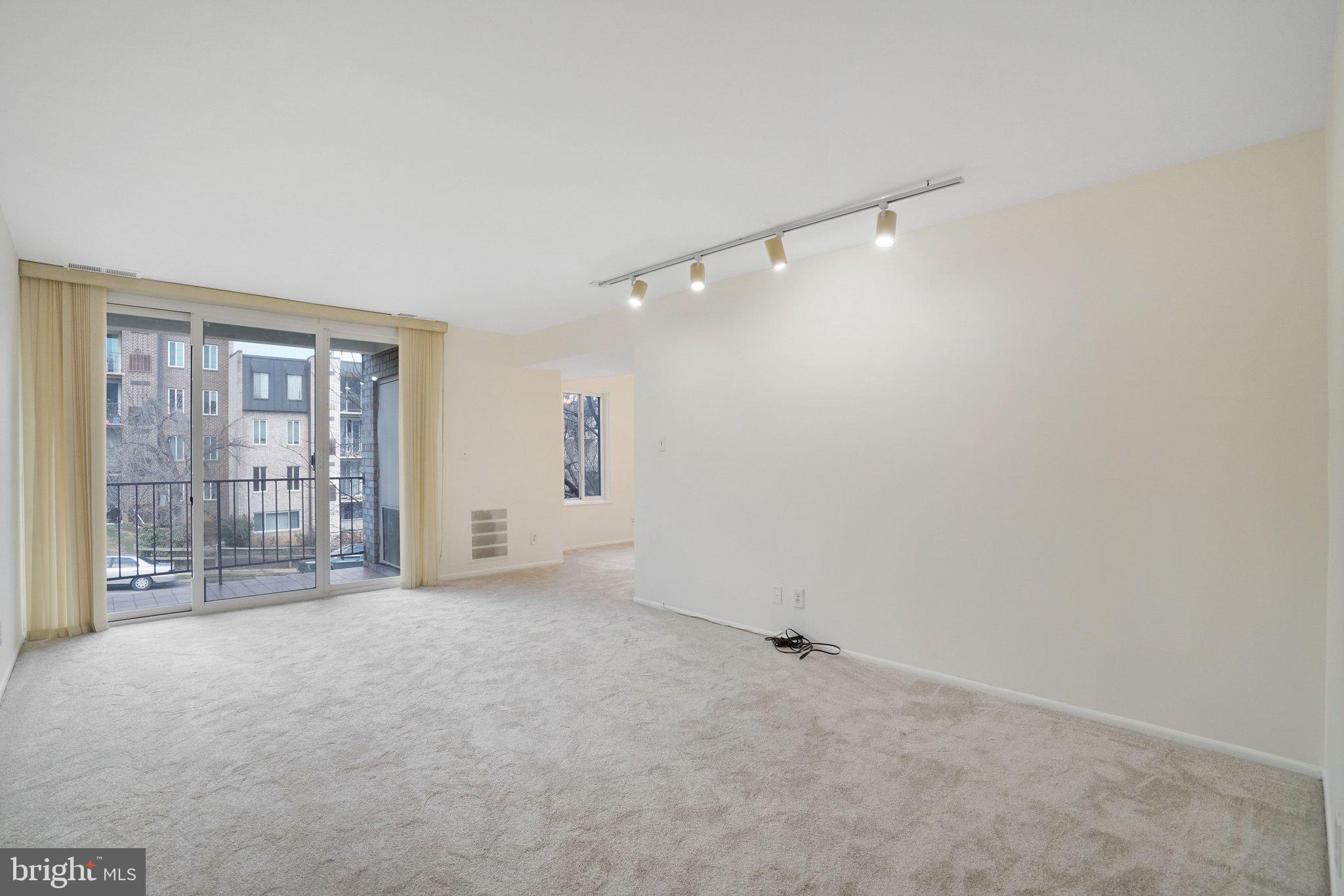 5020 7th Road South, Unit 102 Arlington, VA 22204 - Photo 10 of 30 a view of an empty room with glass door