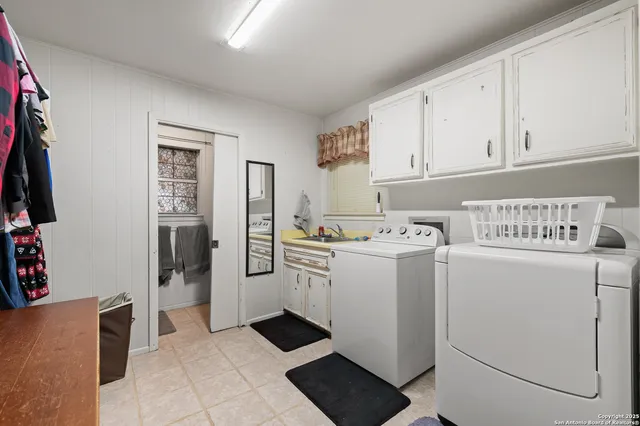 a bathroom with a shower and a glass door