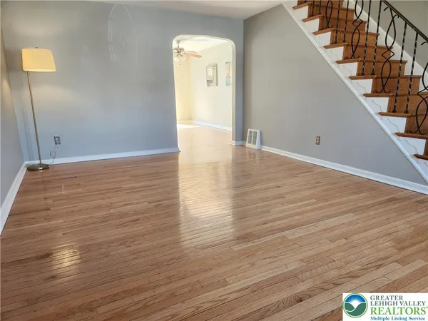 a view of hallway with wooden floor