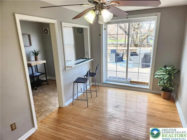 a view of a livingroom with furniture and an entryway
