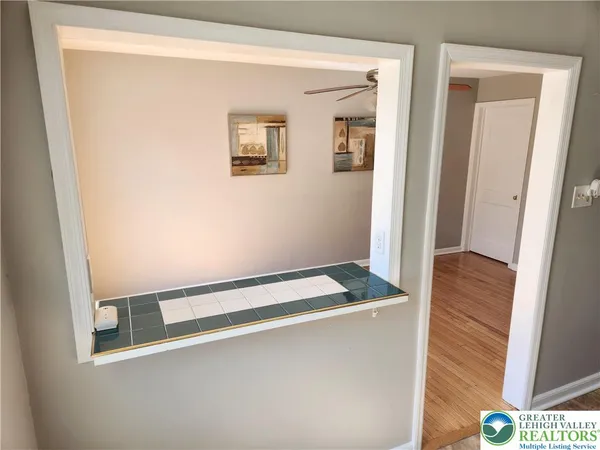 a kitchen with stainless steel appliances a refrigerator and a stove